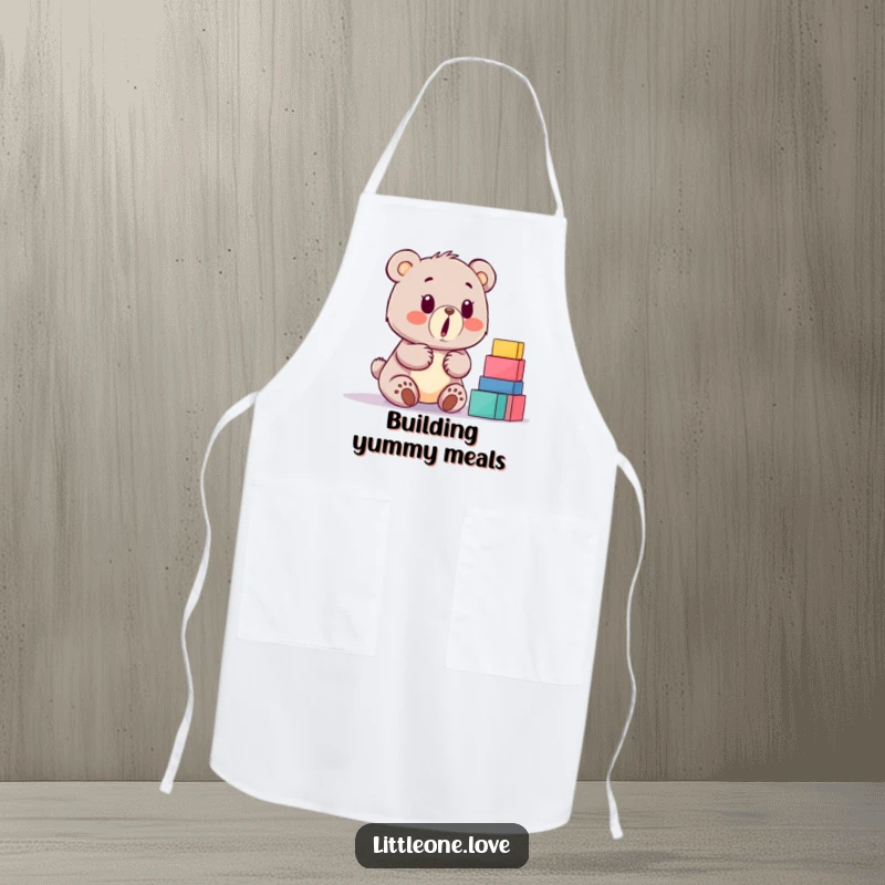 Funny baby bear apron, surprised by a stack of building blocks, cute kitchen accessory for cooking and baking fun.