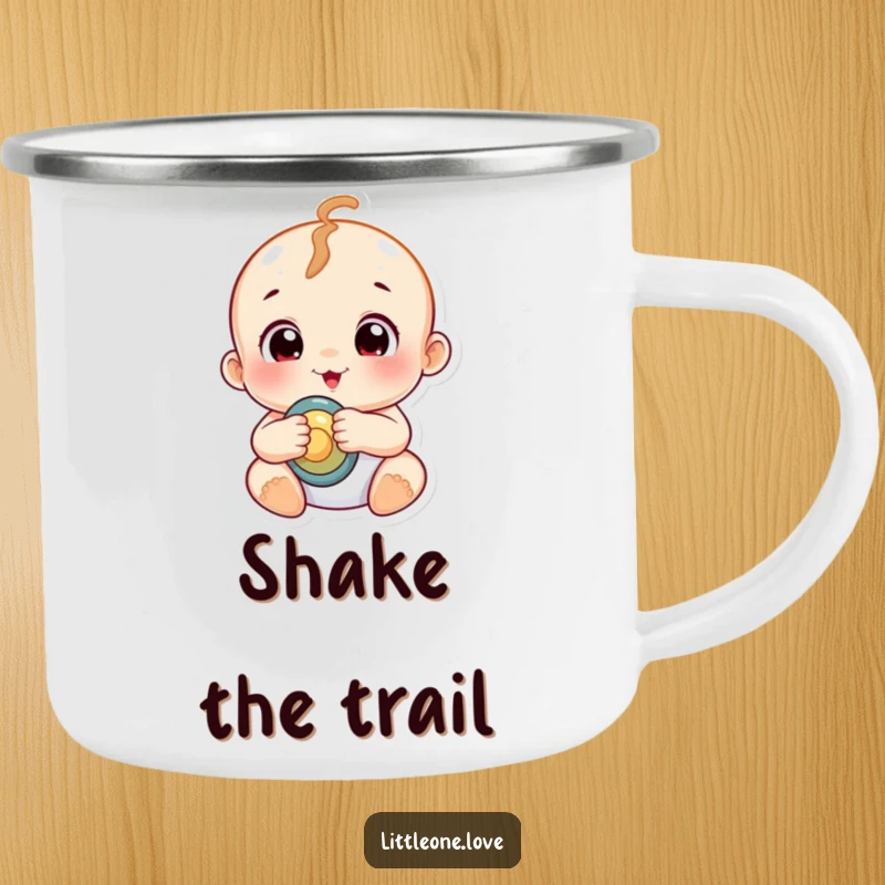 Funny chubby baby with wide, curious eyes holding a rattle, on a durable enamel camping mug.