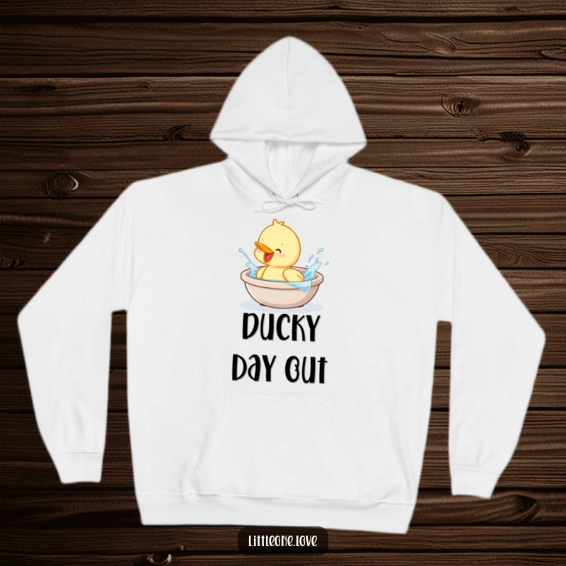 Funny and cozy hoodie with a baby duckling enthusiastically splashing in a tiny tub. Comfortable and humorous.