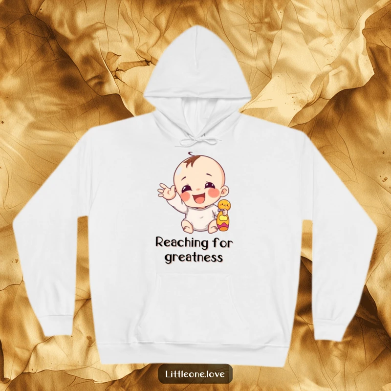 Funny giggling infant with chubby hand reaching for a toy, featured on a warm, plush hoodie.