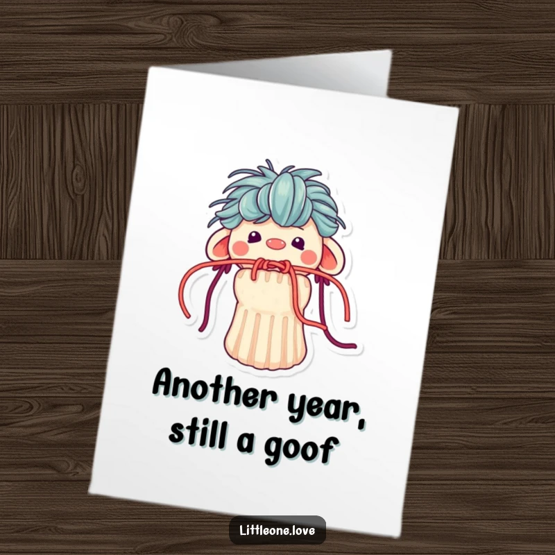 Funny Free Printable Birthday Card: Tiny sock puppet with messy yarn hair stuck in its mouth, looking bewildered.