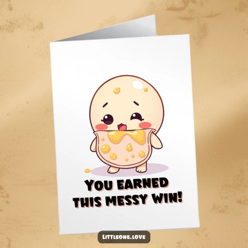 Funny Free Printable Congratulations Card: Bewildered rubber ball in bib, splattered with baby food, celebrating a messy success.