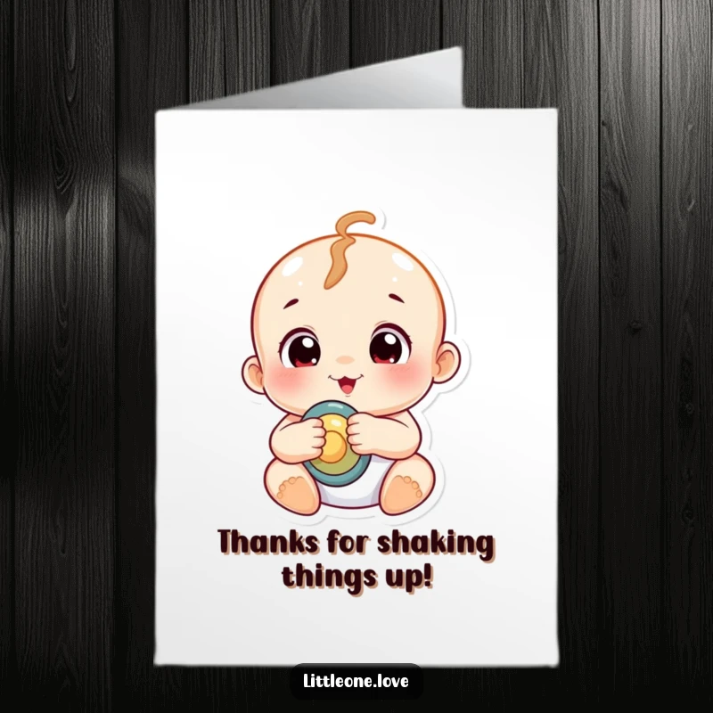 Funny Free Printable Thank You Card: A chubby baby with curious eyes holds a rattle, expressing heartfelt thanks.