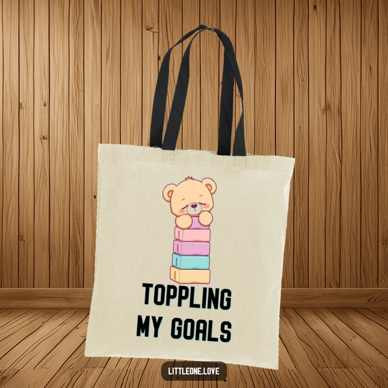 Funny tote bag illustration of a sleepy teddy bear struggling to keep a towering stack of blocks from tumbling down.